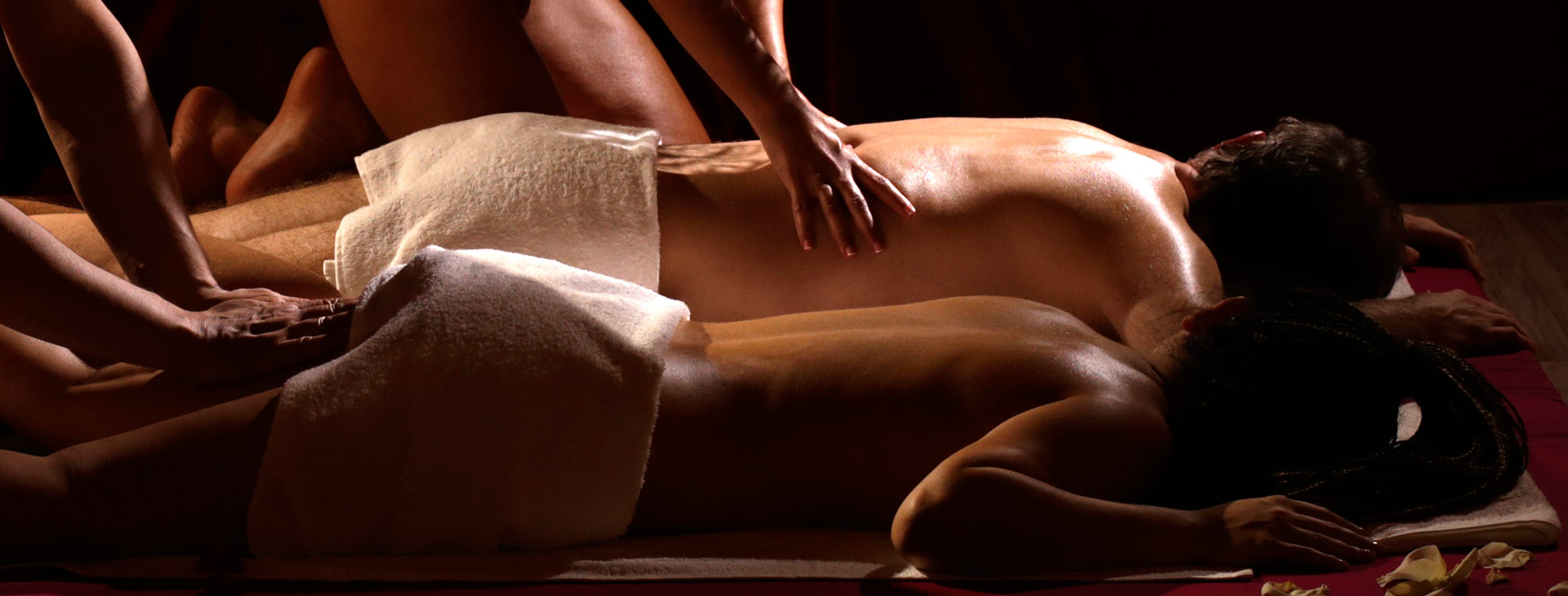 Luxury couples erotic massage in Amsterdam hotel room with sensual atmosphere
